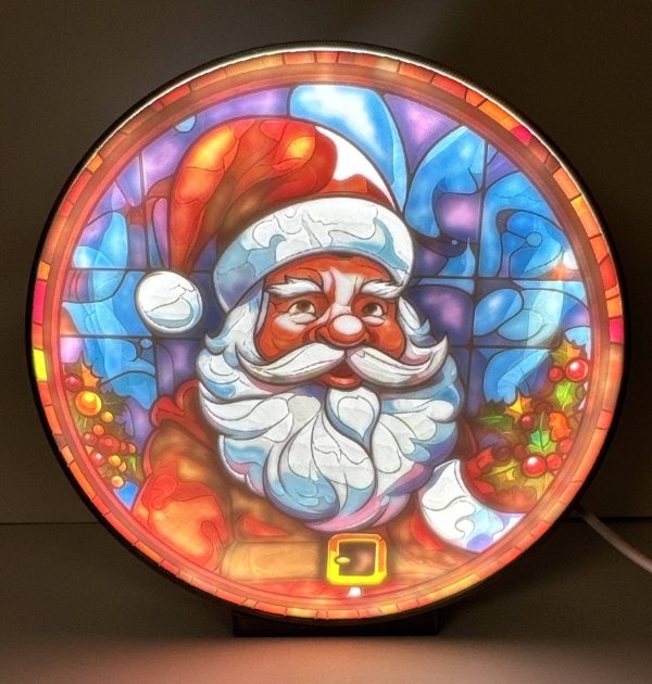 Festive Round Santa Claus Santa Claus Ornament with colorful stained glass design, lit from behind.
