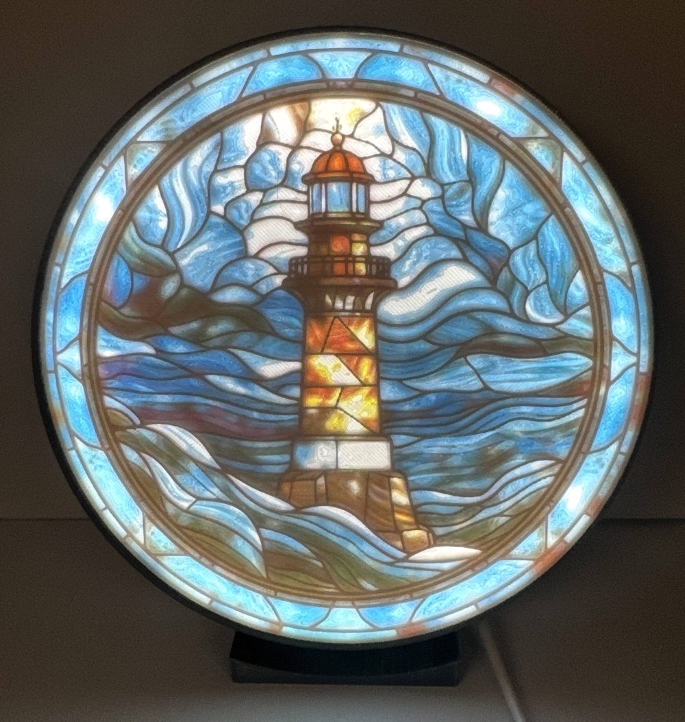 Oceanside Lighthouse Lithophane Lithophane art of a glowing lighthouse with vibrant waves, ideal for home decor.