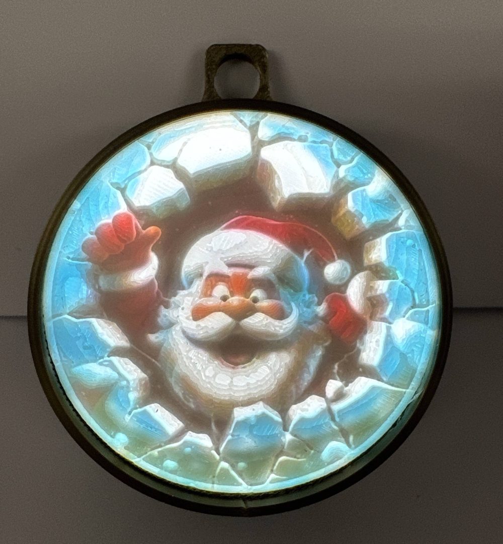 Battery-operated lighted Santa Claus ornament, featuring a funny, waving Santa in a vibrant, icy blue setting.