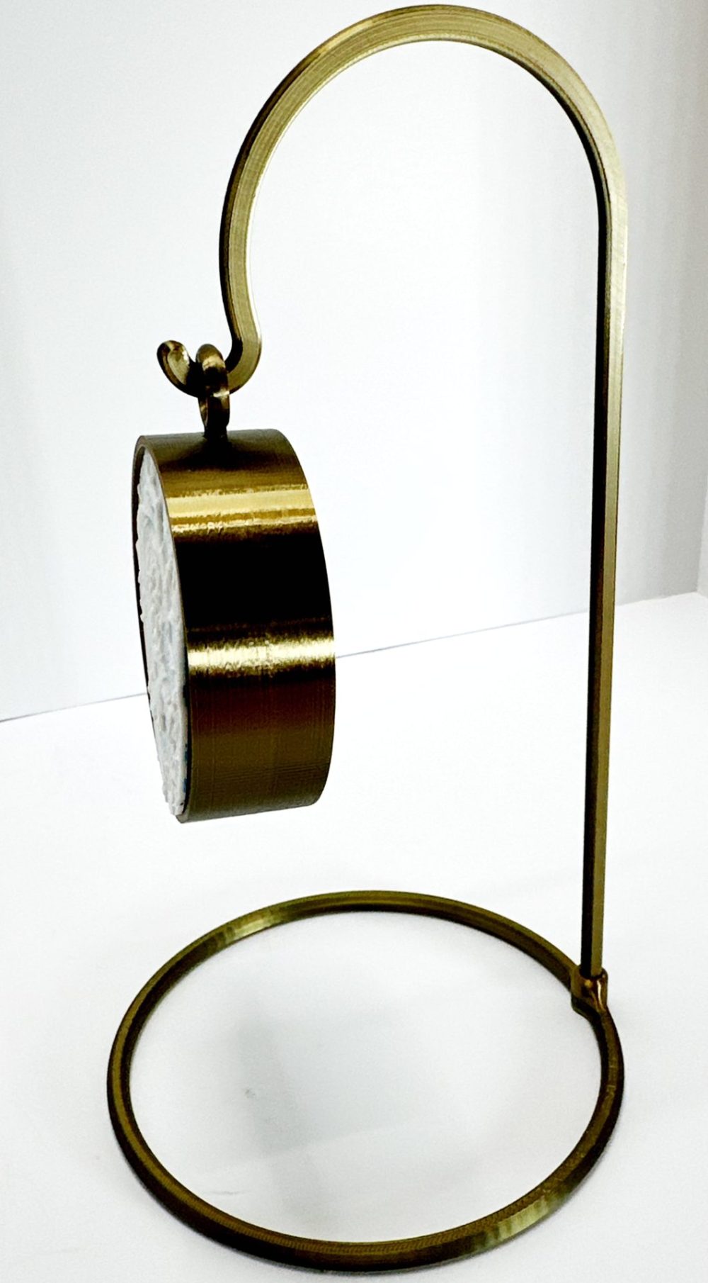 Gold-colored stand display for hanging ornaments, shown empty on the 3D Funny Christmas Ornament Penguin product page.