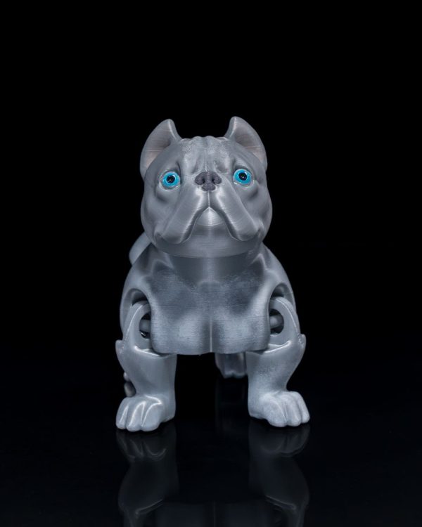 Articulated American Bull Dog Figure on a black background, showcasing its detailed design and bright blue eyes.