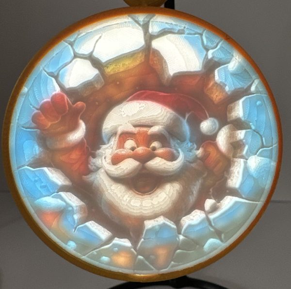 Decorative Christmas ornament featuring a jolly Santa Claus face with a glowing, cracked ice background.